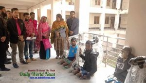 Father and son Salim Zahidul Taihidul are happy to get a wheel chair in Barguna